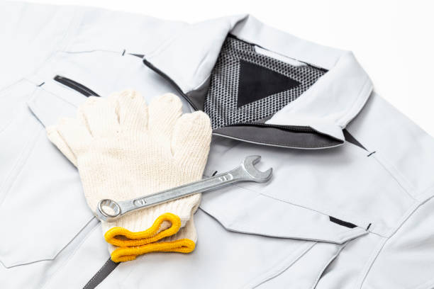 Work clothes and wrench on a white background.