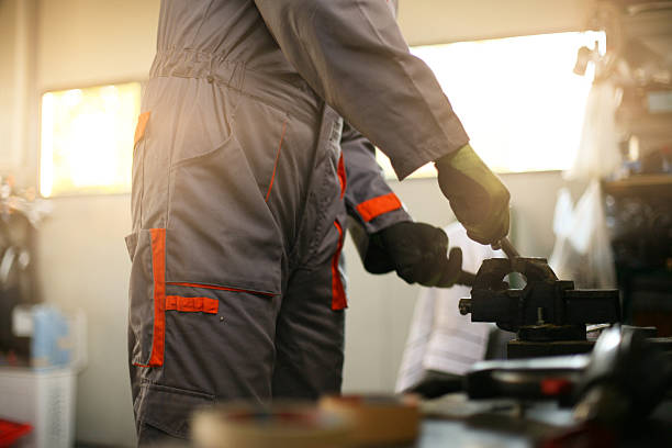 Man working in his workshop. focus is on body part.